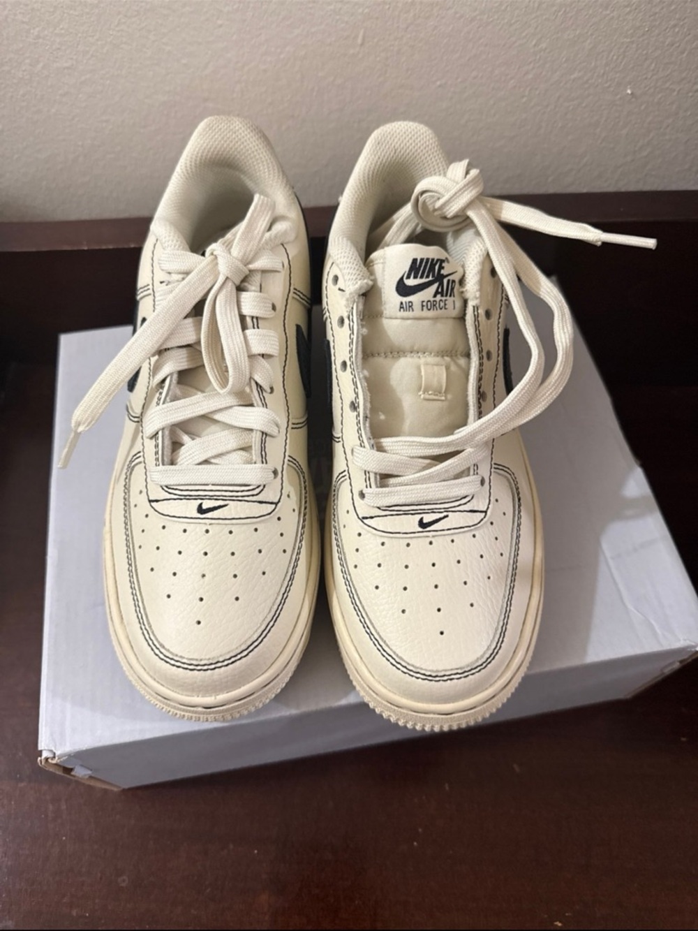 Nike Cream and Black Air Force 1 Low Top Sneakers